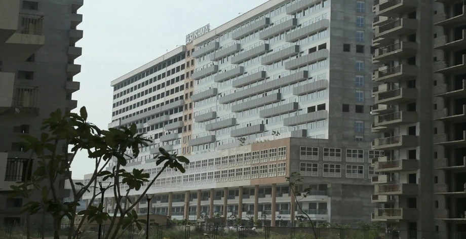 Sushma Infinium, side view of the finished building among residential towers
